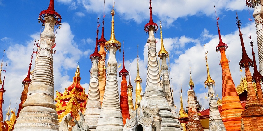 An image showing a view of a traditional pagoda temple surrounded by multiple buildings.
