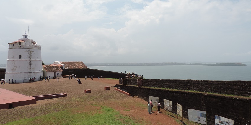 Snapshot of the historic Aguada Fort ruins and the light house by the ocean in Goa