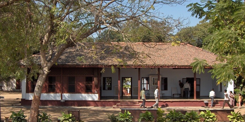 Sabarmati Ashram, the peaceful residence of Mahatma Gandhi, surrounded by serene greenery.