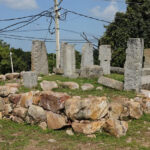 A picture of the remains of a fort in Rajasthan with multiple stupas placed