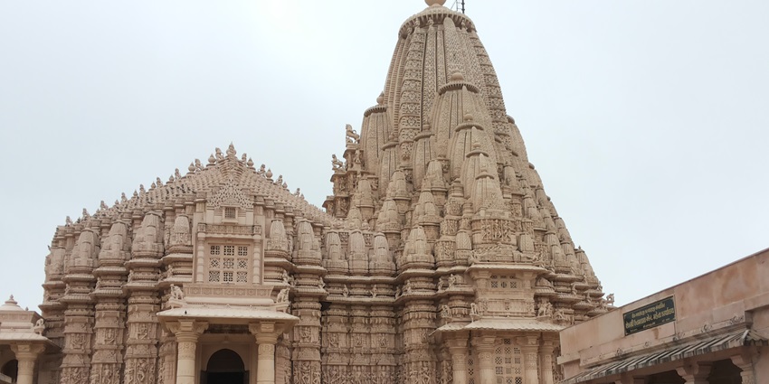 Image of a temple with beautiful architecture during day time under blue sky