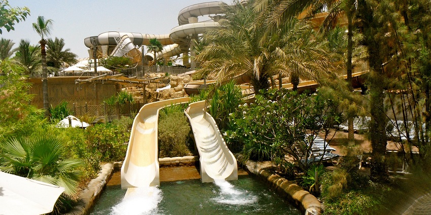 Panoramic view of the beautiful water park amidst the lush green nature and sunny day