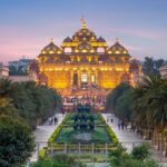 An image of the beautiful Akshardham Temple at night showcasing the water and laser shows.