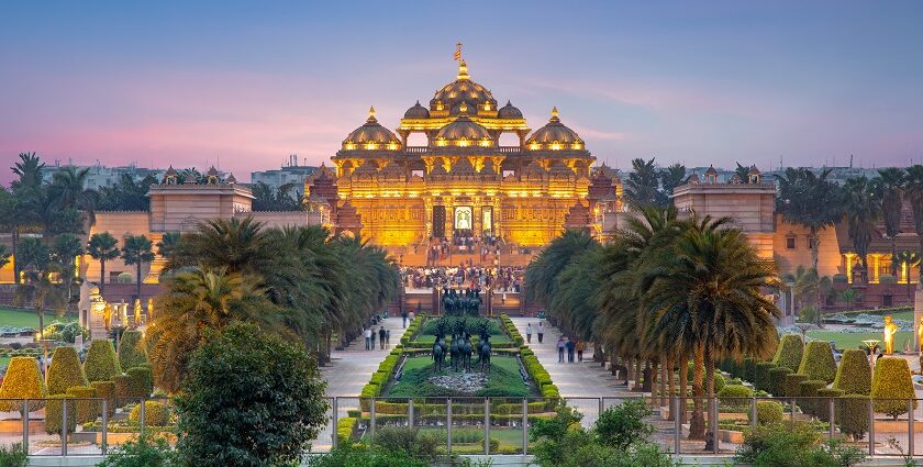 An image of the beautiful Akshardham Temple at night showcasing the water and laser shows.