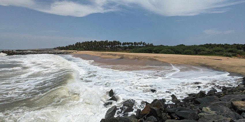 A view of the serene Akshi Beach, one of the top places to visit in Alibaug for couples.