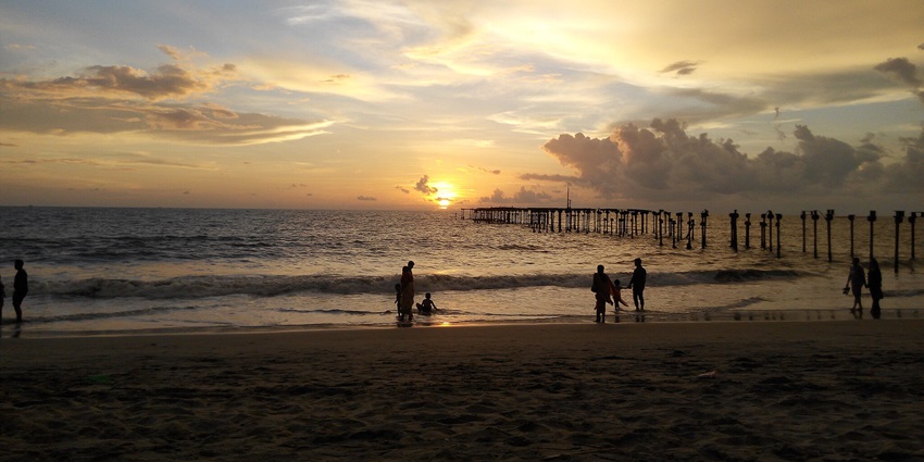 A stunning sunset over Alleppey Beach, with vibrant colors reflecting on the water.