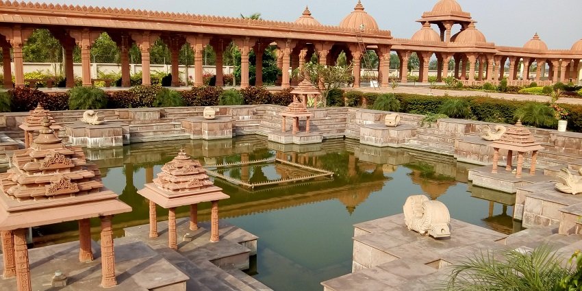 A picturesque lake inside Althan Swaminarayan Temple that is an architectural marvel