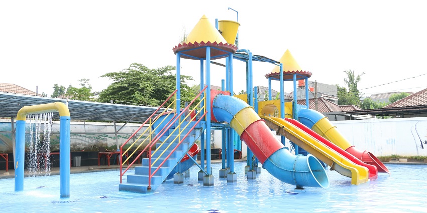 Image of a water park and rides people enjoying the rides and water splash