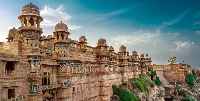 Concrete structure of Gwalior Fort, with historic architecture in the background.