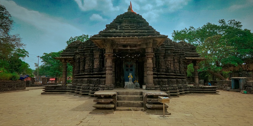 Ancient Ambarnath Shiv Temple with intricate stone carvings and a stepped shikhara.