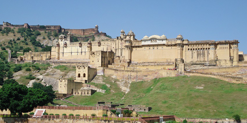 The beautiful Amer Fort in Jaipur, surrounded by greenery and a pleasant environment.