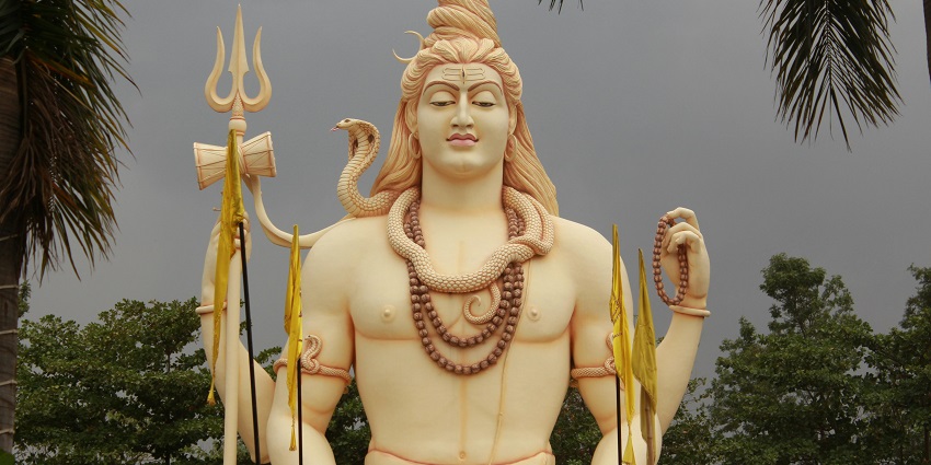 Close-up of a majestic Shiva statue, intricately carved, with a serene expression.