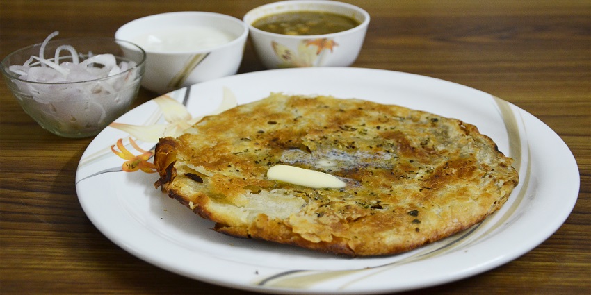 Amritsari kulcha filled with spiced potatoes and tangy chutney - best food in Ludhiana.