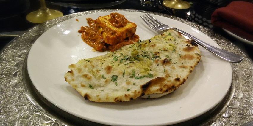 Amritsari aalo kulcha served with paneer, offering the authentic flavours