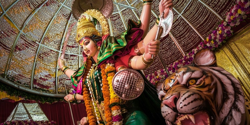 A beautifully crafted idol of Maa Durga Devi, adorned with vibrant colours and attire.