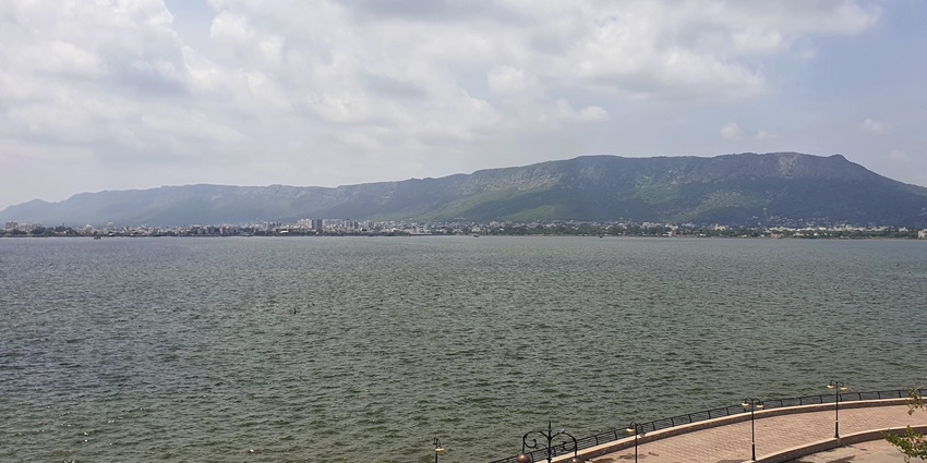 A calm perspective of Ana Sagar Lake in Ajmer which is encircled by marble pavilions.