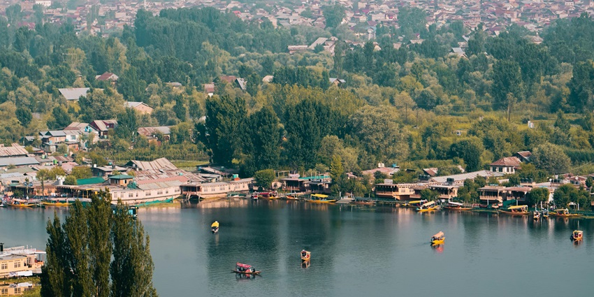 View of waterfront houses with a large body of water and houses developed along its side.