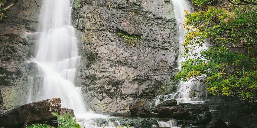 Scenic waterfall, one of the Araku Valley Waterfalls, flowing through deep forests.