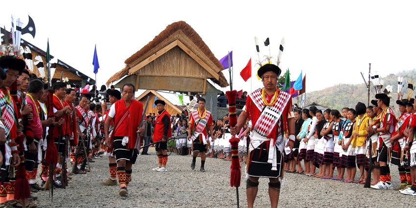 Angami tribal dancers in traditional attire performing a cultural dance in Nagaland