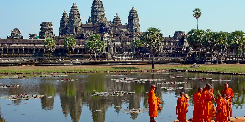 Angkor Wat's west-facing temple facade with intricate carvings, a great tourist place to visit in Cambodia