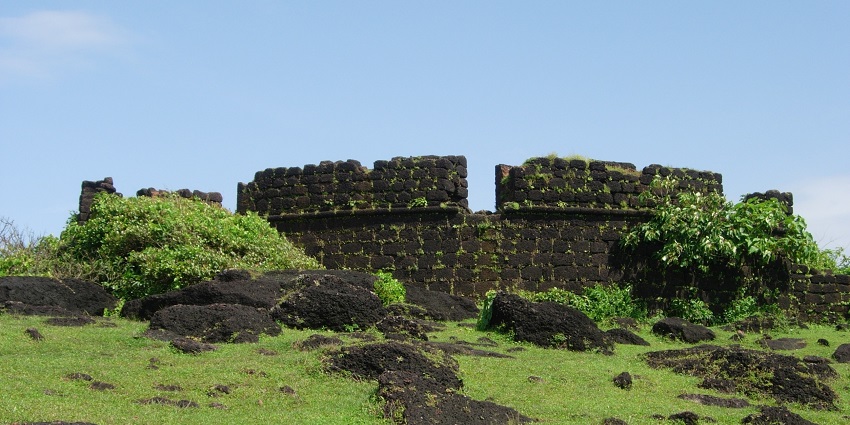 Beautiful view of fort ruins on green grass field and the fort was constructed by the Portuguese in the year 1505