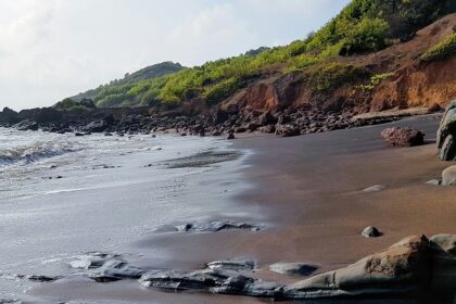 A breathtaking vista of glistening waters meeting the pristine golden sands at the beach.