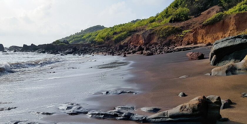 A breathtaking vista of glistening waters meeting the pristine golden sands at the beach.