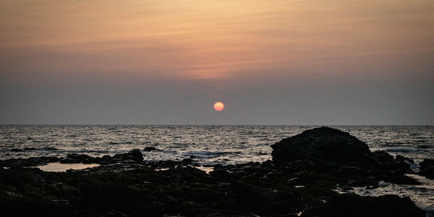 A view of scenic sunset at Anjuna Beach, one of the best places to visit in Goa at night.