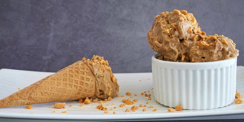An image of an apple crumble with ice cream which is one famous delicious food.