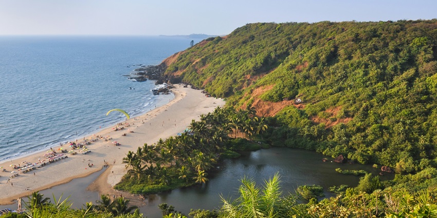 An image of the sea and the serene Sweet Lake on the beach at Arambol in Goa, India.