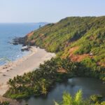 A view of the pristine Arambol Beach and serene Sweet Lake from a high point of view.