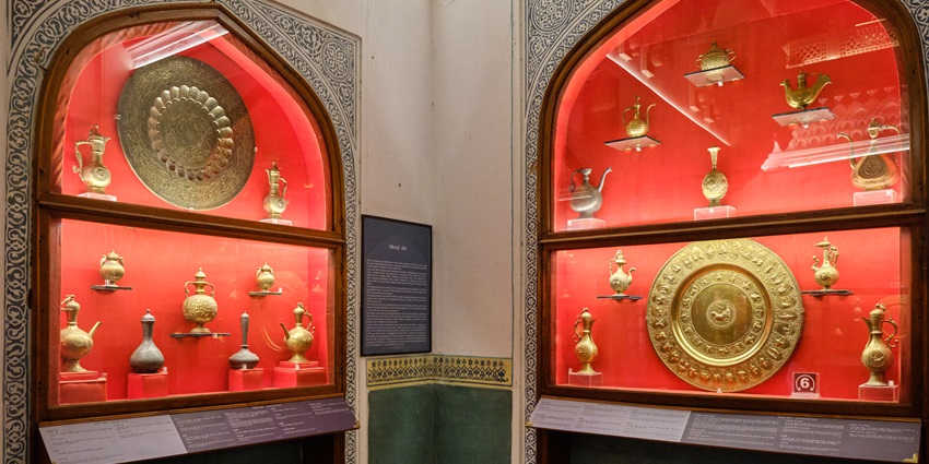 Sculptures and artefacts displayed in a museum like the Archeological Dept Museum.