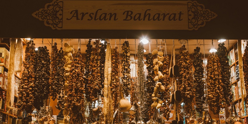 An image of Arna Barna Market with a colourful array of trendy footwear, shopping bags, and home decor.