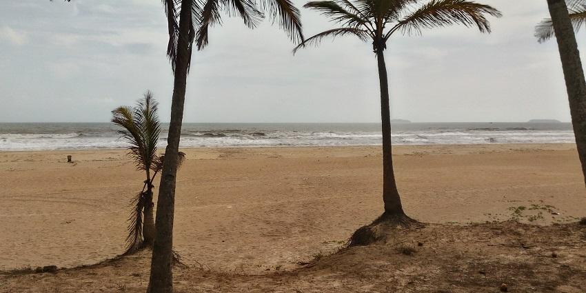 Scenic image of the beautiful Arossim Beach during the sunset in Goa