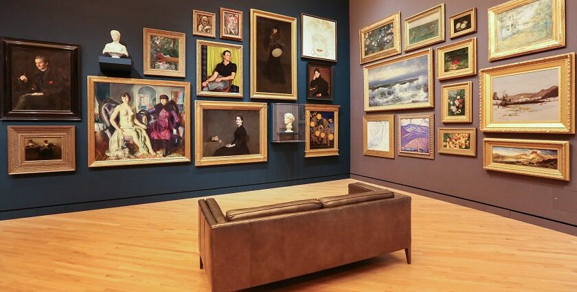 An inside view of a famous artistic spot featuring various paintings and sculptures.