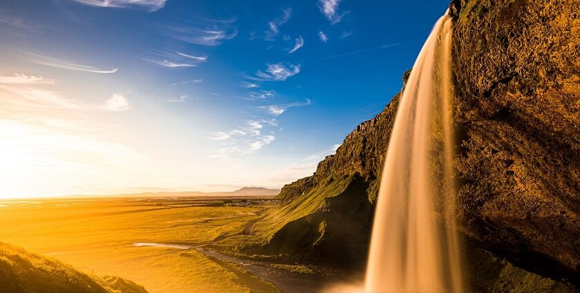 A stunning landscape featuring cascading Arvalem waterfalls surrounded by lush greenery