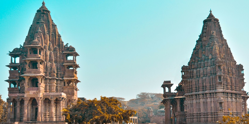 Maa Ashapuri Temple in Himachal Pradesh, amidst a scenic backdrop