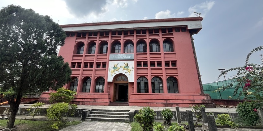 View of the Assam Rajyik State Museum with the clear blue sky in the background