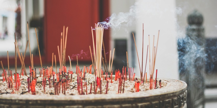 A glimpse of incense sticks burning as a part of spiritual rituals inside the place.
