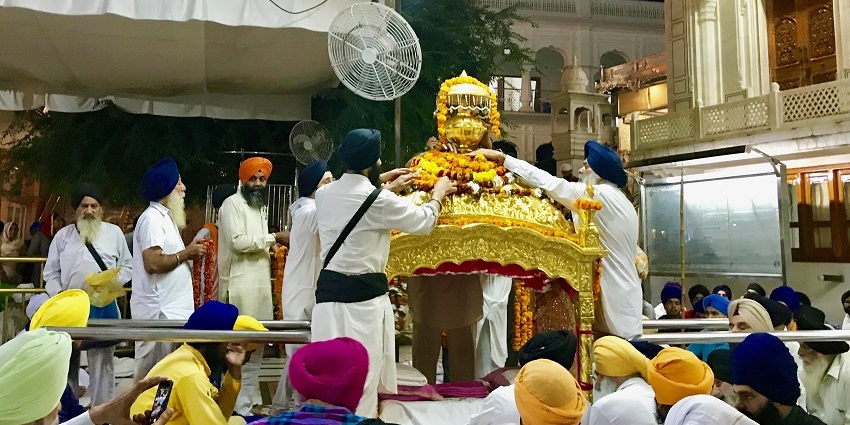 Beautiful image of the Palki Sahib ceremony inside the premises of the beautiful Golden Temple