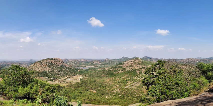 Panorama from Avalabetta hilltop overlooking rolling green hills and distant valleys