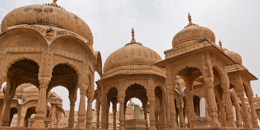 Carved cenotaphs honour Jaisalmer's royals, showcasing Rajasthan's rich heritage.