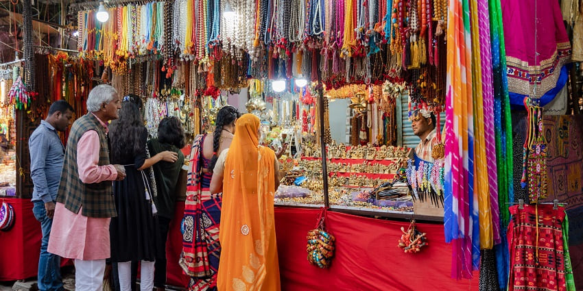 Street shopping in Udaipur’s Bada Bazaar offers vibrant shopping for sarees, jewellery, leather.