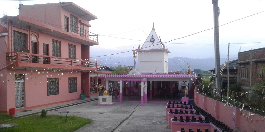 Badimalika Temple unfolds panoramic views across the rolling green hills and dense forests.