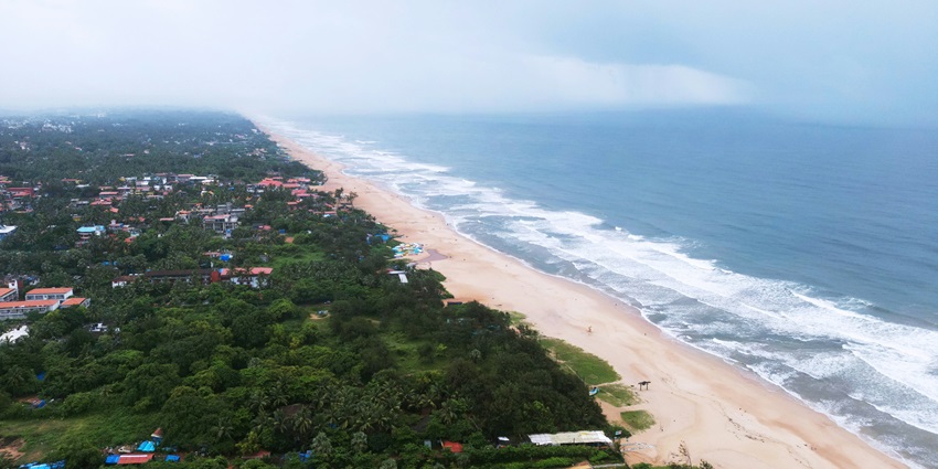 An aerial view of the serene Baga Beach, one of the famous places to visit in Anjuna.