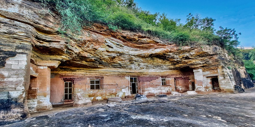 The mesmerising view of the Bagh caves surrounded by rocks, which is a Buddhist cave