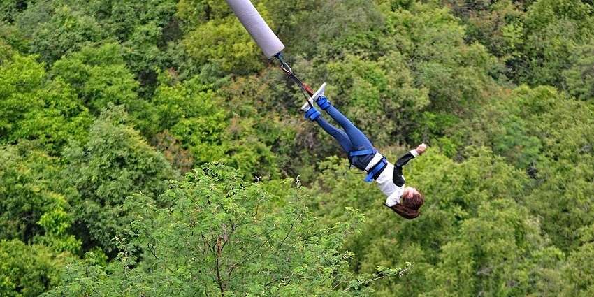 Urban bungee jumping platform in Nepal, offering a cityscape view during the jump.