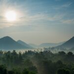 Picturesque view overlooking the sun hues reflecting on the misty mountains of Balimela wildlife sanctuary