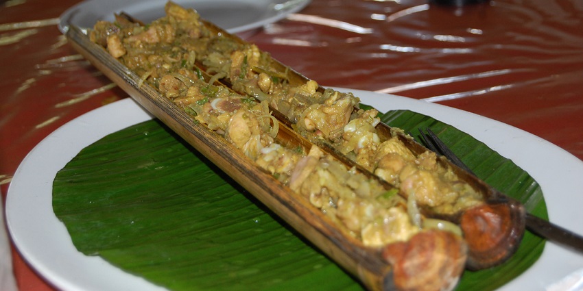 Image of a restaurant served on plate delectable bamboo chicken, authentic dish.