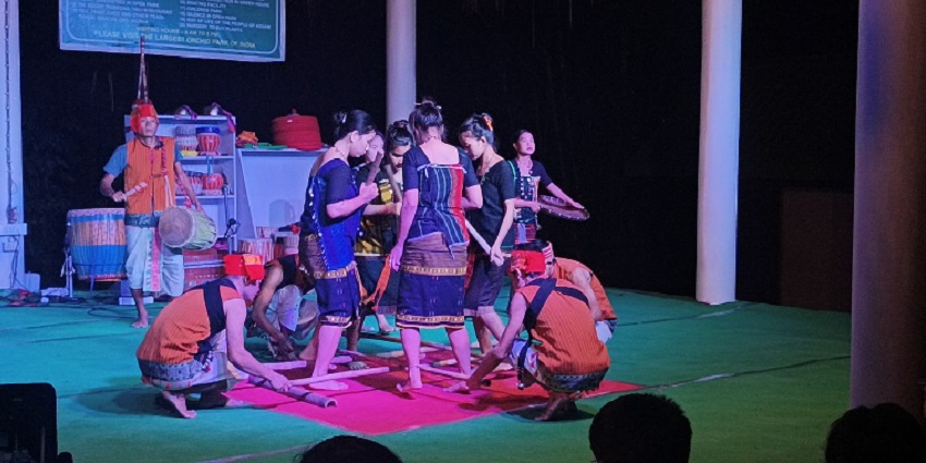 A vibrant bamboo dance performance showcasing colourful costumes and rhythmic movements.